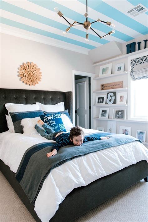 This boy's bedroom features white walls with a world map decor near the study table set on the hardwood flooring. Big Boy Bedroom Ideas | Home Decor | Curls and Cashmere