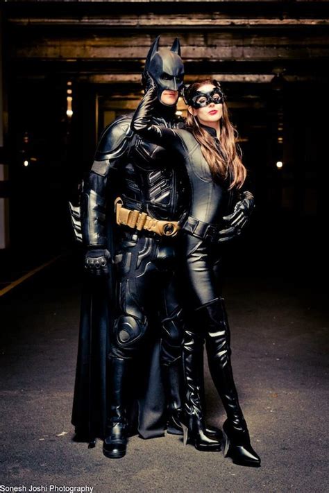 Two People Dressed Up As Batman And Catwoman