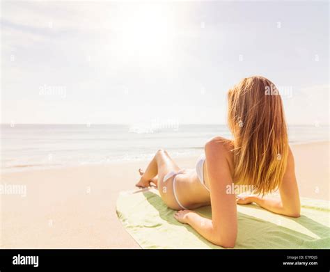 Woman Relaxing On Beach Stock Photo Alamy