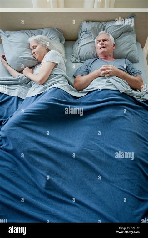 Senior Couple Sleeping In Bed Stock Photo Alamy