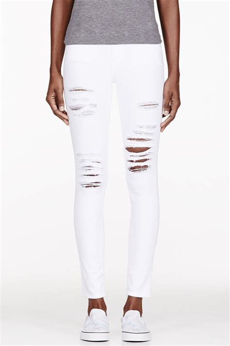 Lyst Frame Le Skinny De Jeanne Ripped Jeans In White Save 34