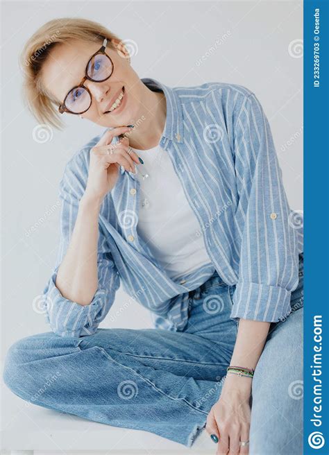 Portraits Of A Stylish European Woman With Glasses In A Bright Room A