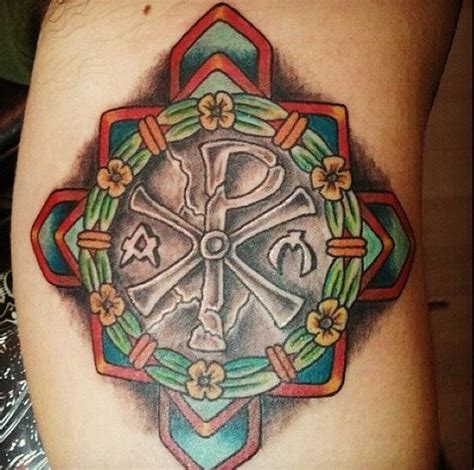 The symbol of the cross has been used in diverse ways and as a way to express religion and belief. Big detailed colorful cross tattoo on arm stylized with ...