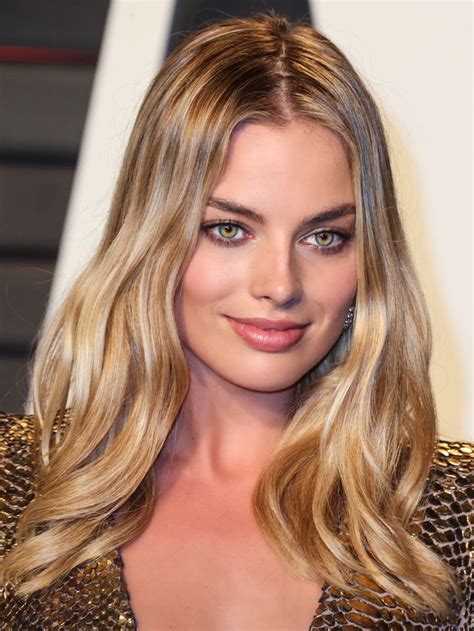 insanely gorgeous golden blonde hair looks so beautiful with her hazel green eyes margot