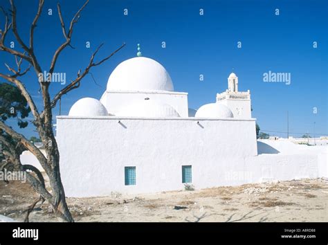 Etched Against The Deep Blue Sky The Orthodox Muslim Mosque Of The Stranger In The Town Of Houmt