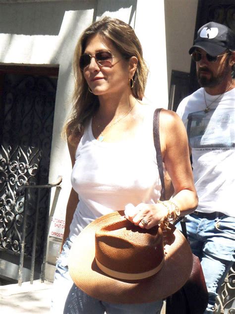 Jennifer Aniston Flashes Nipples As She Goes Braless In Tight White