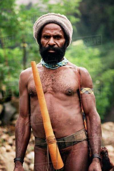Indigenous Man Wearing A Wool Cap And Carrying A Knit Bag Over His