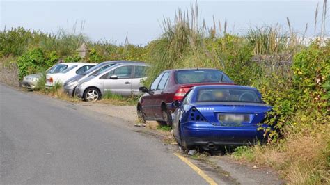 abandoned cars in guernsey road replaced with boulders bbc news