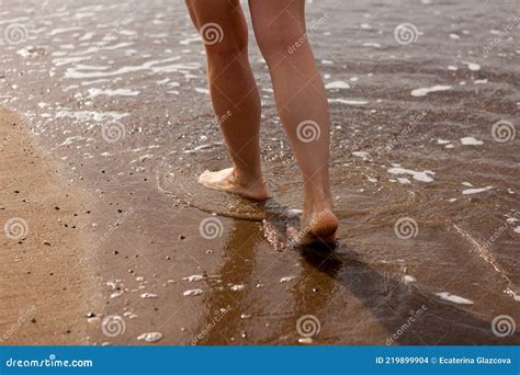 The Girl X S Legs Close Up Barefoot On The Sand And The Sea Shore