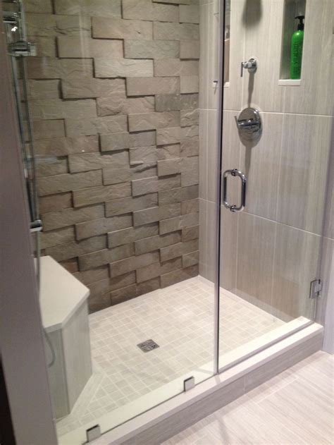 But tiling a shower is actually trickier than tiling other areas of your bathroom. This bathroom features our large V-tile in sandstone grey ...