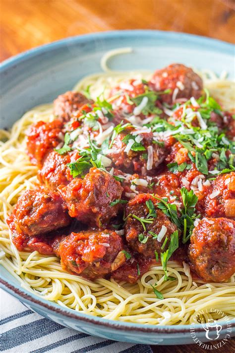 In a large bowl, combine the ground beef, ground pork, reserved onion and garlic mixture, bread crumbs, ricotta, parsley, eggs, parmesan, milk, salt, and pepper. Spaghetti and Meatballs - Catz in the Kitchen