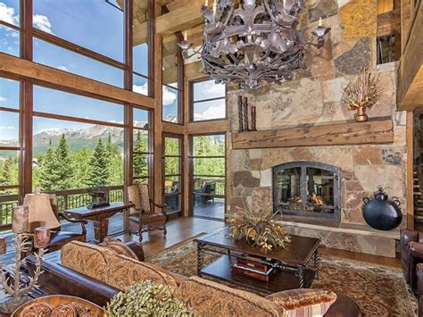 Downstairs there is a hall, kitchen/breakfast room, large sitting room, utility and third bedroom. Log and Stone Colorado Ski Chalet with Great Room