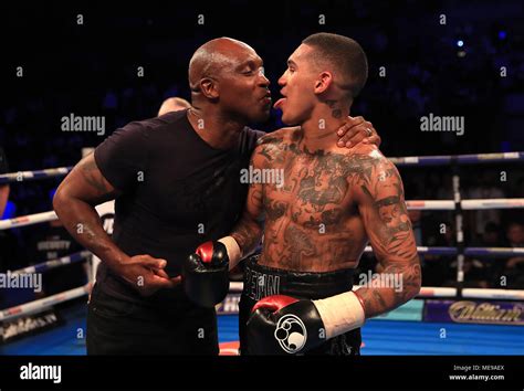 conor benn celebrates winning the welterweight contest with father
