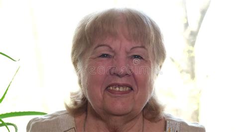 Smiling Senior Woman Face Portrait Elderly Lady In Beige Dress Alone