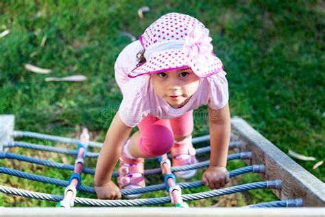 Child Girl Climbing By The Rope Ladder Stock Photo Image Of