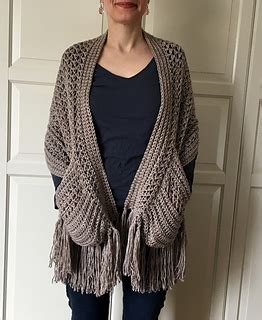 They can easily turn into a bright decor, especially on children's clothes. Ravelry: Perfect-Pockets Shawl pattern by Sonja Hood
