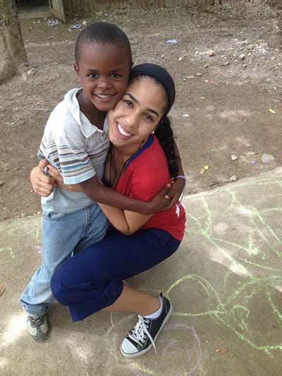 Amor En Accion Missionary Janelle Jay Gets A Big Hug From A New Friend During A Mission Trip To