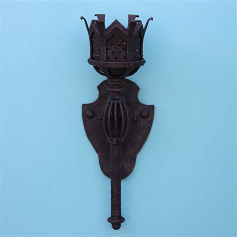 A wall sconce is a specific type of wall mounted fixture that can add both general and accent lighting in your home. Lights of Tuscany 5245-1 Gothic Medieval Castle Indoor Wall Torch Light