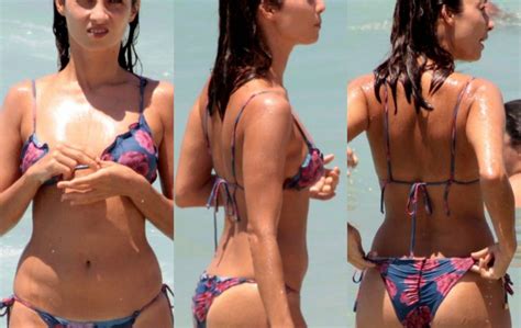 Júlia Oristanio ex de Rafael Vitti exibe boa forma na praia amigo