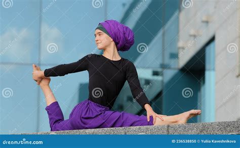 Muslim Islamic Arabian Indian Woman In Hijab Doing Yoga Workout