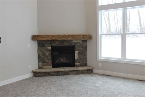 The corner pieces used for the header at the top of the fireplace opening will be installed vertically instead of horizontally, so opt for stones of similar height in this area. Fireplace Designs and the Rustic Mantel Trend! - Katie Jane Interiors