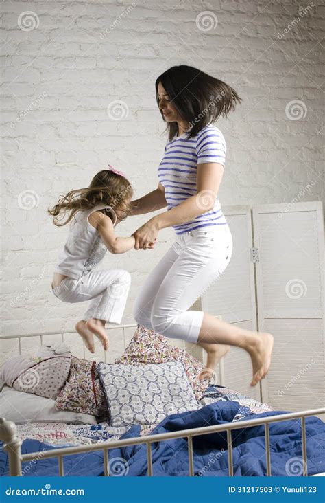 Portrait Of Mother And Daughter Laying In Bed And Smiling Stock Image Image Of Human Love