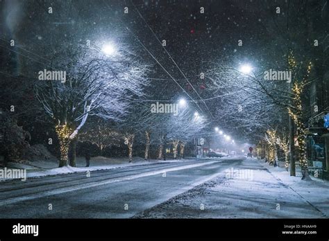 Snowy Road At Night In Downtown In Winter Season Stock Photo Alamy
