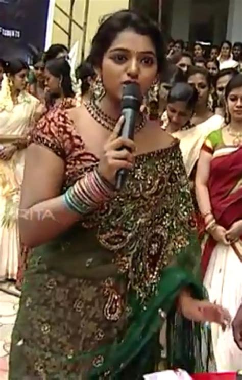 In 2007, she auditioned as a competitor in idea star singer aired on asianet television but was selected as an anchor for the programme. malayalam Television anchor Meera Anil hot navel and ...