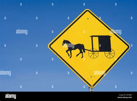 Road Sign Warning Of Horse Drawn Buggys Stock Photo Alamy