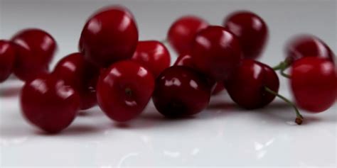 Red Cherries Falling Onto Table Stock Video Footage 0016 Sbv 300067024