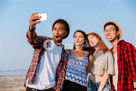 Group Of Friends Taking Selfie And Making Funny Faces Outdoors Royalty Free Stock Image