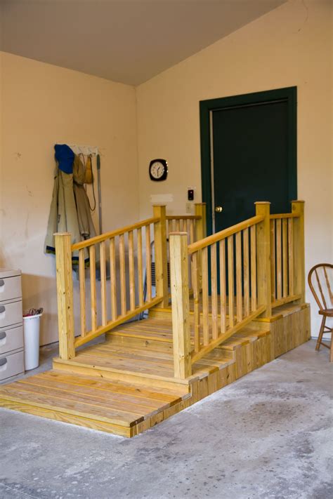 A Wooden Staircase Leading Up To A Green Door