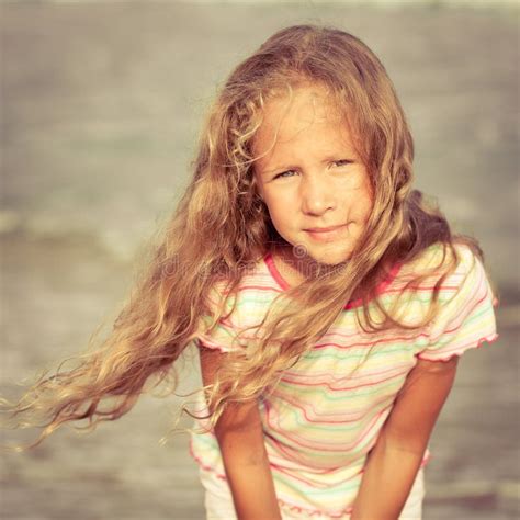 Adorable Happy Smiling Little Girl On Beach Vacation Stock Photo