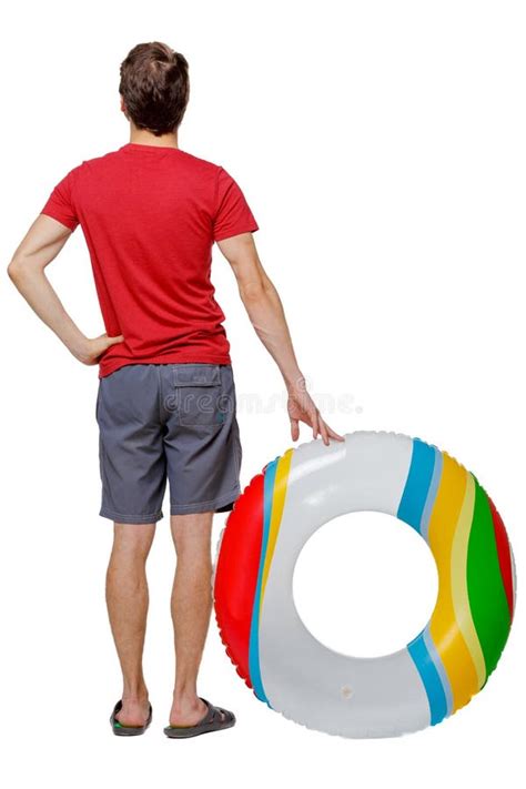 Back View Of A Man In Shorts With An Inflatable Circle Zdjęcie Stock Obraz Złożonej Z Kurort