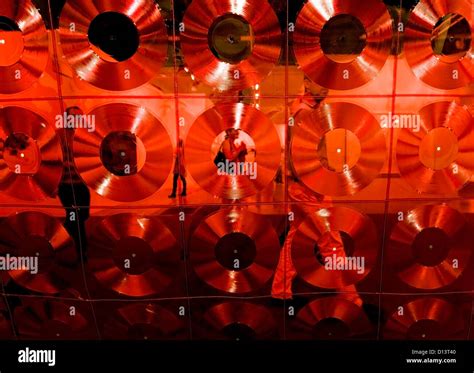 Dec. 06, 2012 - Miami Beach, Florida, US - Fair attendees pass artist