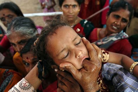 Indian Believers Swallow Live Fish As Asthma Cure Photo Pictures Cbs News