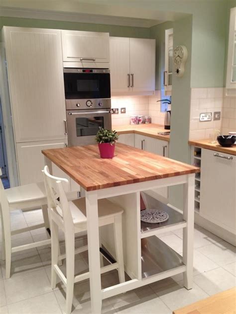 Hemnes dresser turned kitchen island. butcher block island. Perfect but with stools and seating ...