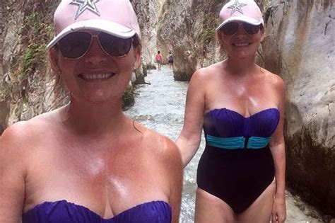 Lorraine Kelly Shows Off Her Slimline Figure In Strapless Swimsuit On