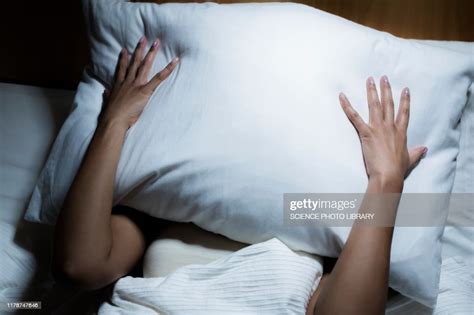 Woman Covering Her Face With Pillow Photo Getty Images