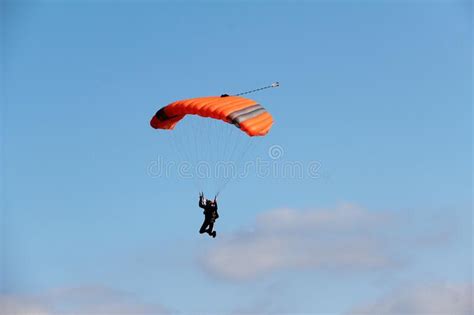 Low Angle Shot Of A Person Parachuting In The Sky Stock Image Image
