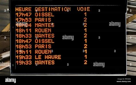 Electronic Departures Board Displaying Train Times To Paris At Vernon