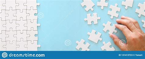 Fotosearch enhanced rf royalty free. Banner Of Male Hand Putting The Last Piece In The Puzzle ...