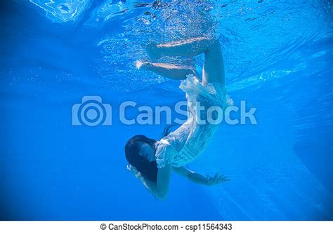 Woman Wearing A White Dress Underwater In Swimming Pool Canstock