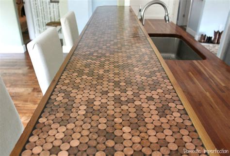 I poured a very thick layer of bar top epoxy over all the sheets (we did 1/2 of the kitchen at a time) and let it cure at 76 degrees for 3 days in a heated room. Penny Countertop - Domestic Imperfection