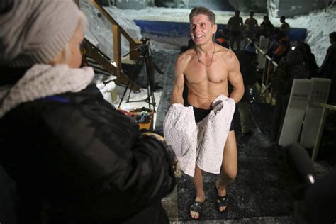 Taking The Plunge In Icy Siberian Waters Locals Mark Orthodox Epiphany