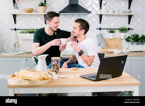 Happy Gay Couple Drinking Coffee And Having Fun Together Everyday Morning Routine Of Gay Couple