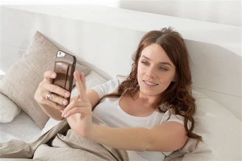 Female Taking Selfie Lying In Bed Stock Image Image Of Phone Self 88398407