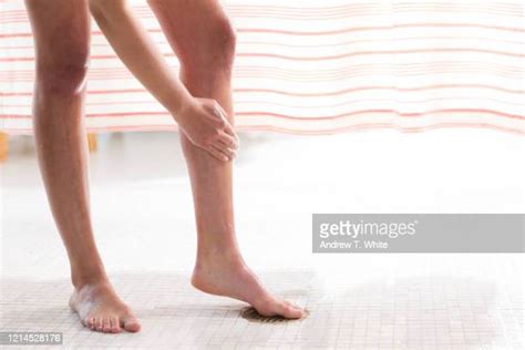 washing legs shower photos and premium high res pictures getty images