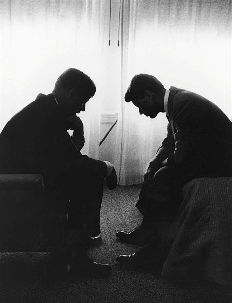 John F Kennedy Consults With His Brother Robert Kennedy During
