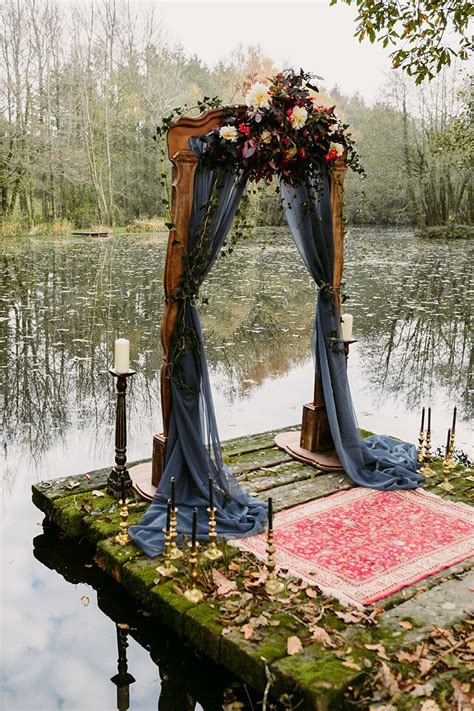Our Rustic Arch Vintage Rug And Candlesticks By The Lake For A Wedding